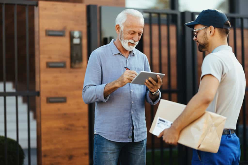 Parcel delivery driver collects signature from recipient using Wise Systems Driver App