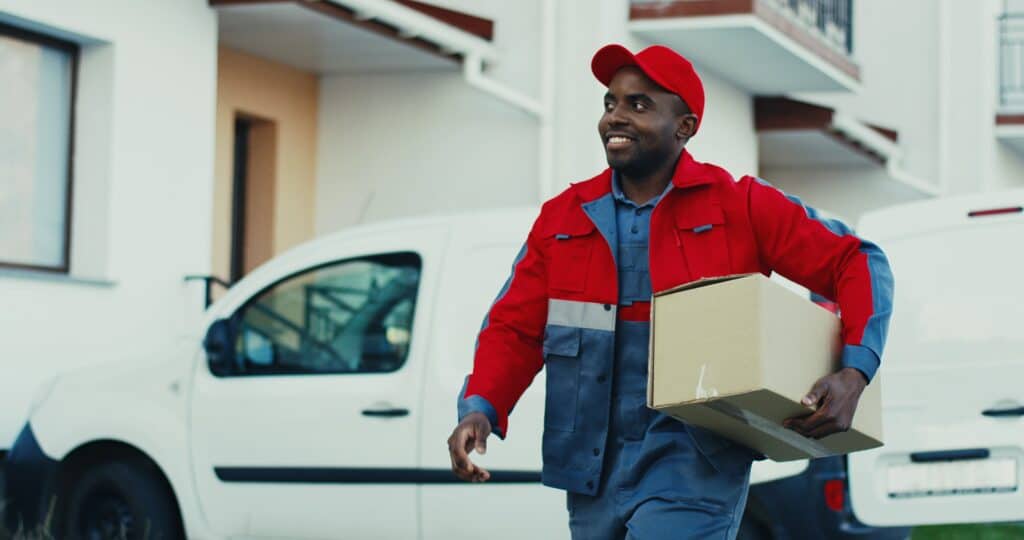 Delivery driver bringing package to customer