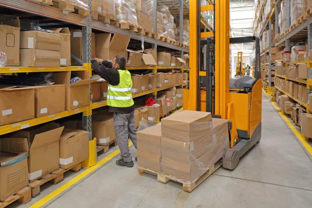 Warehouse worker picking orders in a fulfillment warehouse
