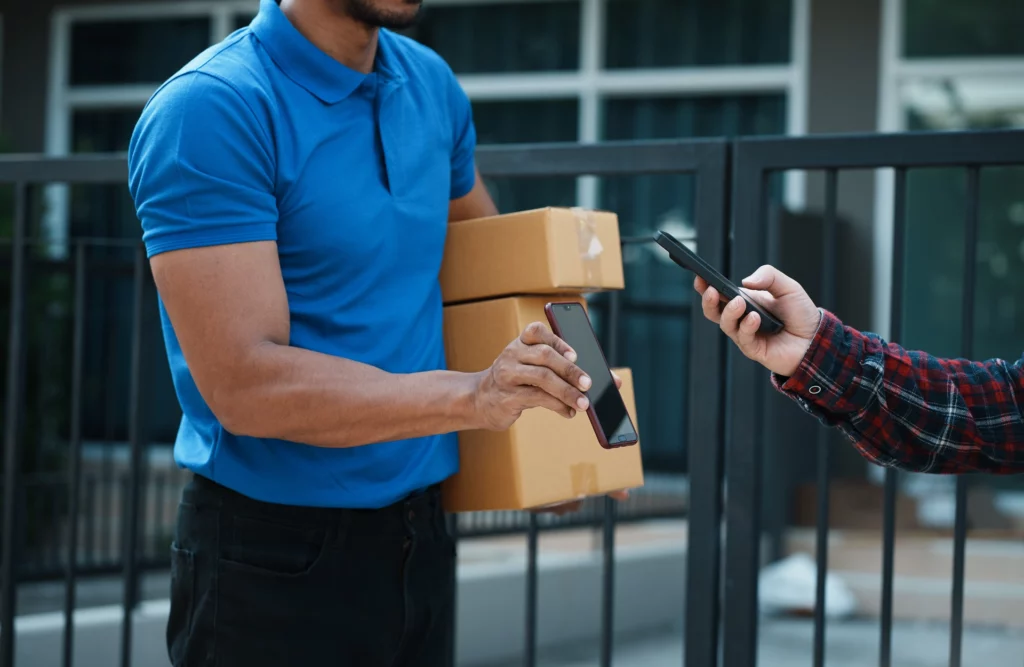 Delivery person scanning customer identification for contactless delivery