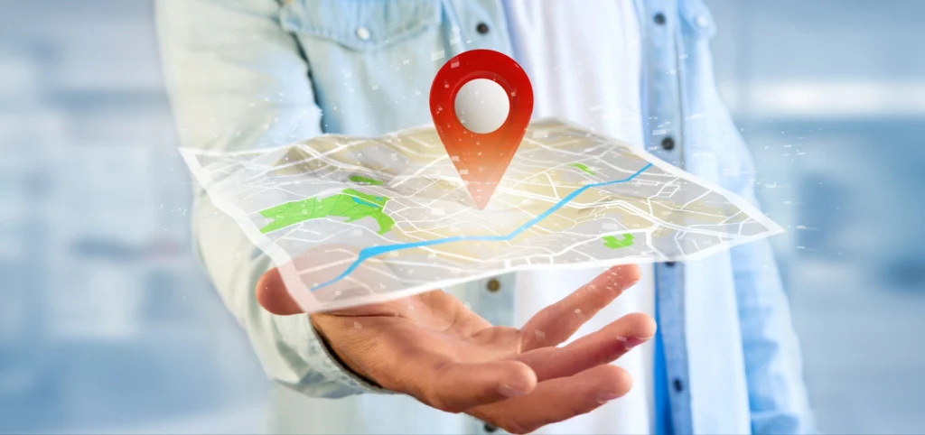 Person holding a map with a location pin